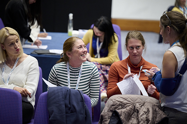 Member smiling at conference