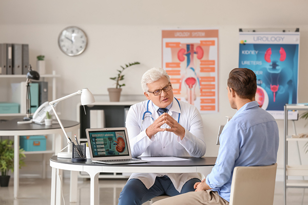 Urologist talking to patient