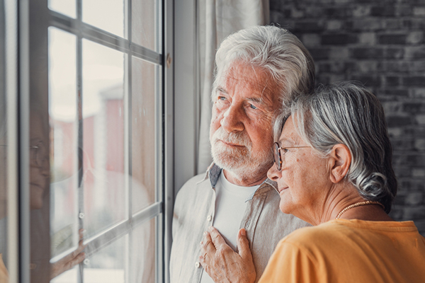 Elderly couple looking pensive